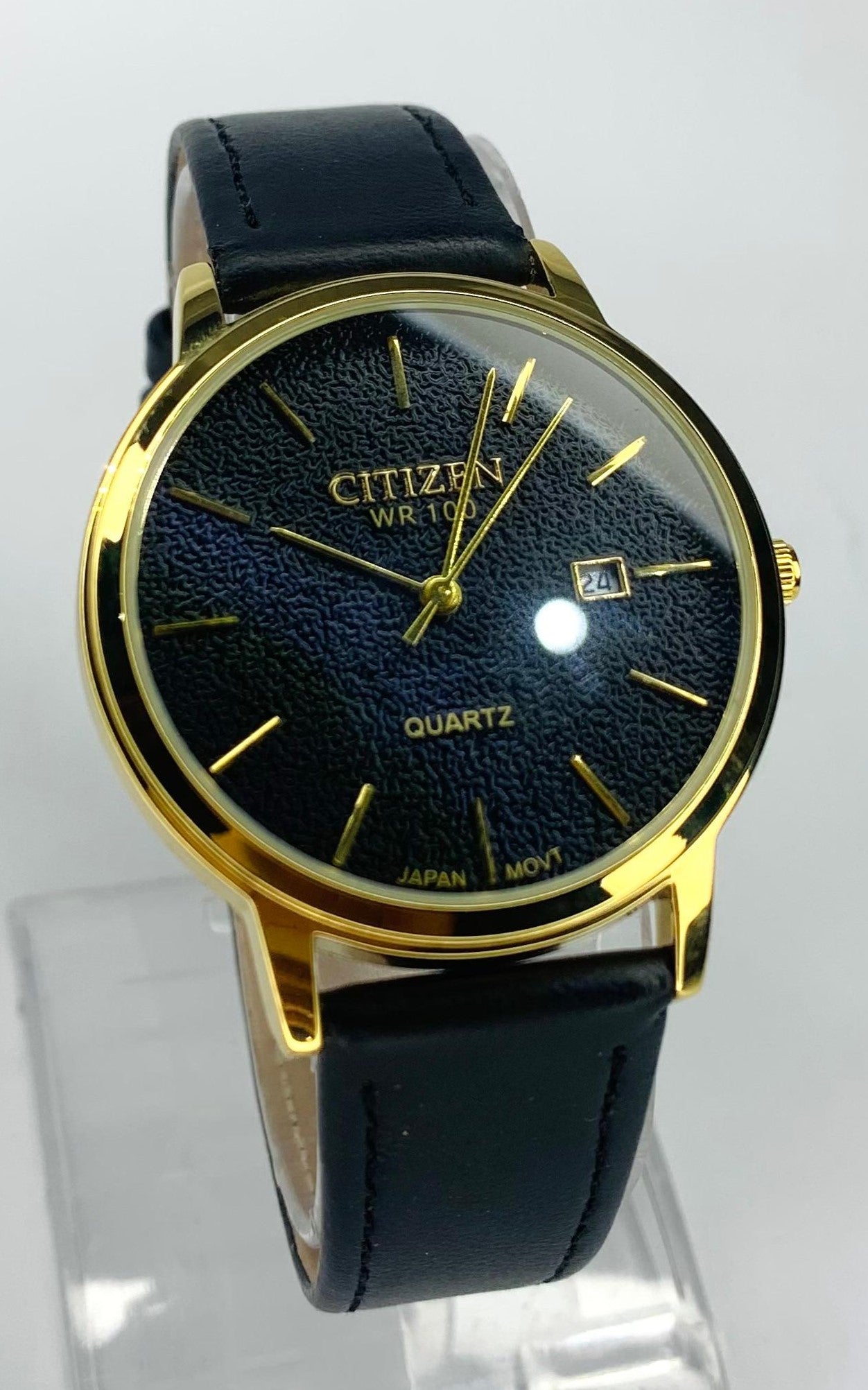 Citizen - Quartz watch with a Black Leather Band And Gold Toned Case